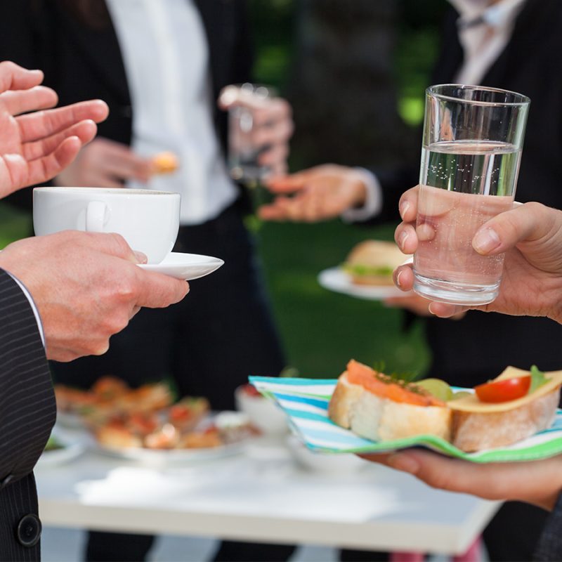 People eating and drinking at a corporate event