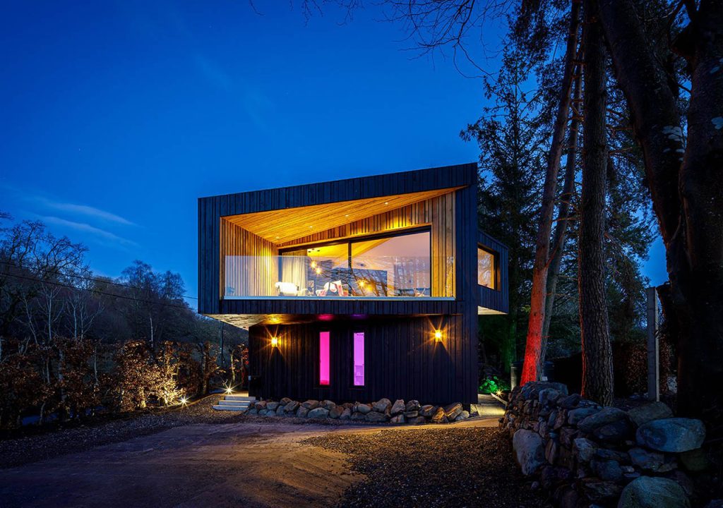 A Loch Venachar Lodge lit up at night