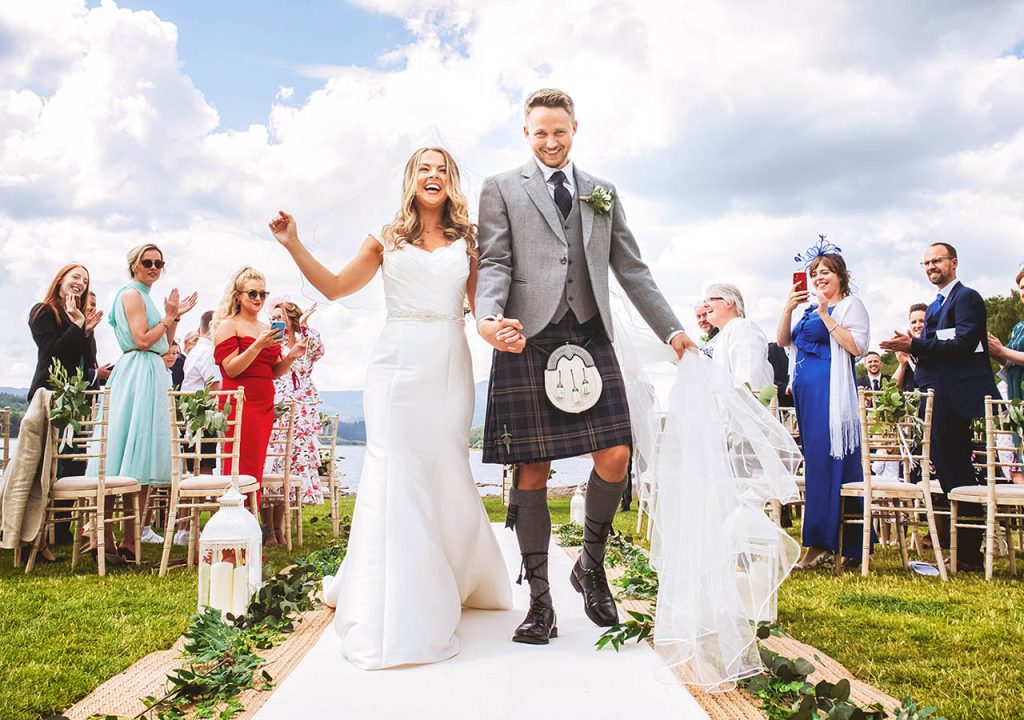 A bride and groom at their wedding at Loch Venachar