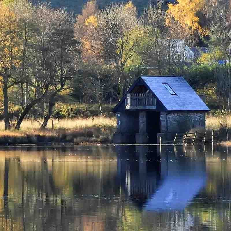A wooden cabin by the side of Loch Venachar.