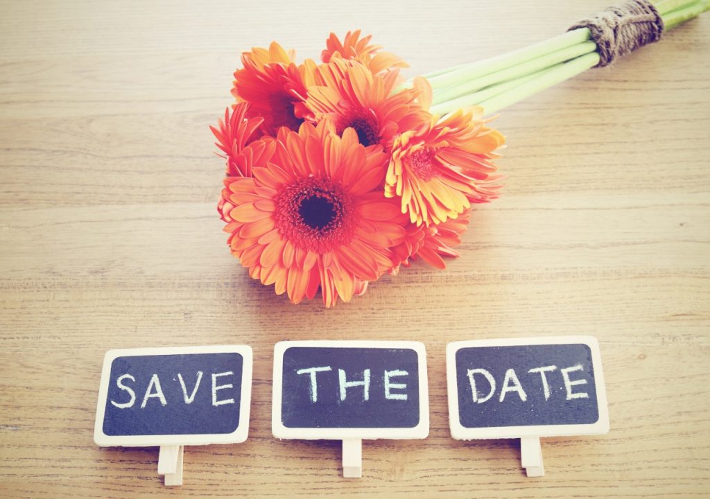 Save the date image with orange gerberas