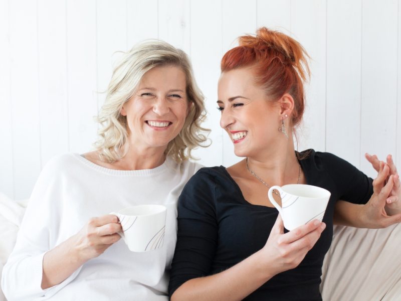 Mother and daughter smiling