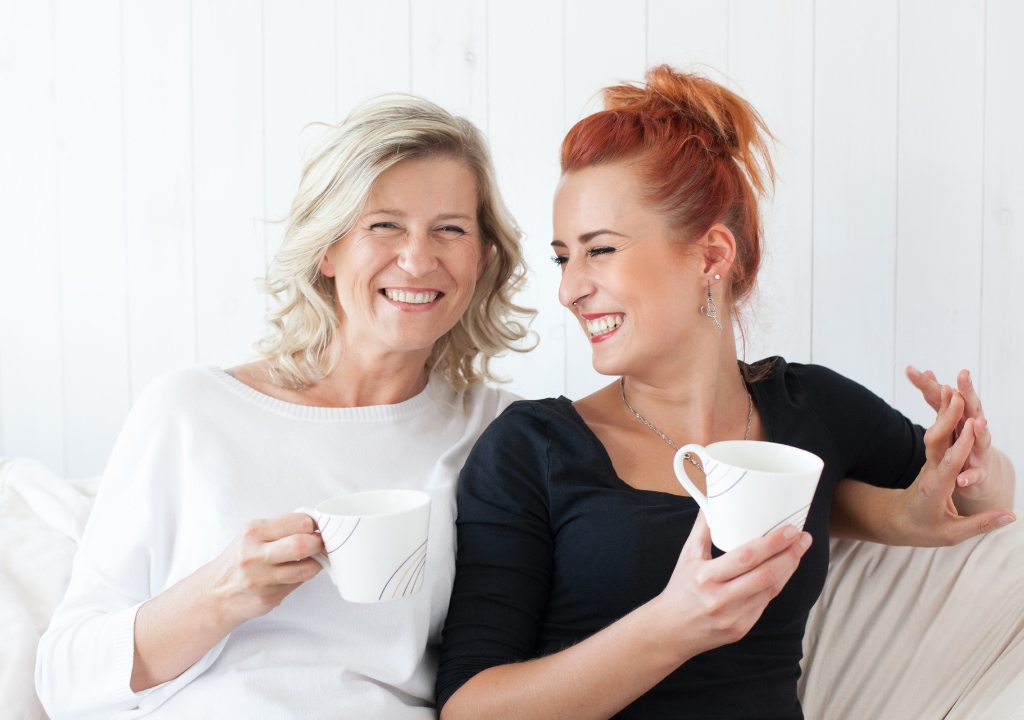 Mother and daughter smiling