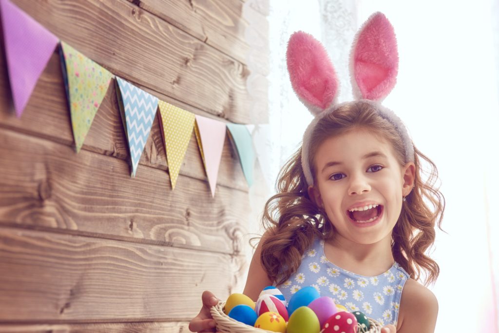 Child wearing bunny ears for Easter
