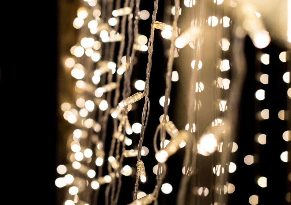 Strings of fairy lights at an evening event