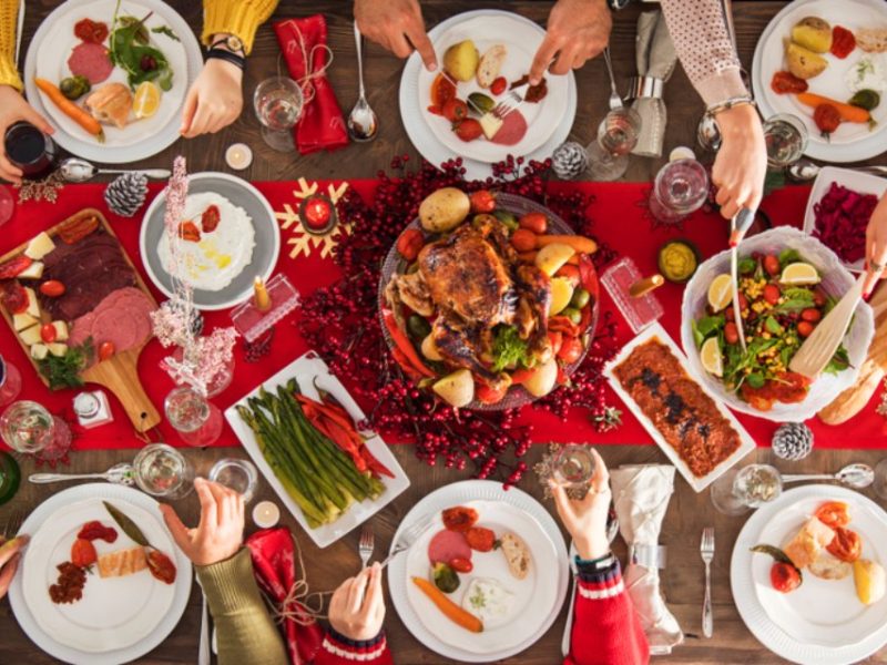 People around a sharing table enjoying Christmas lunch at Venachar Lochside
