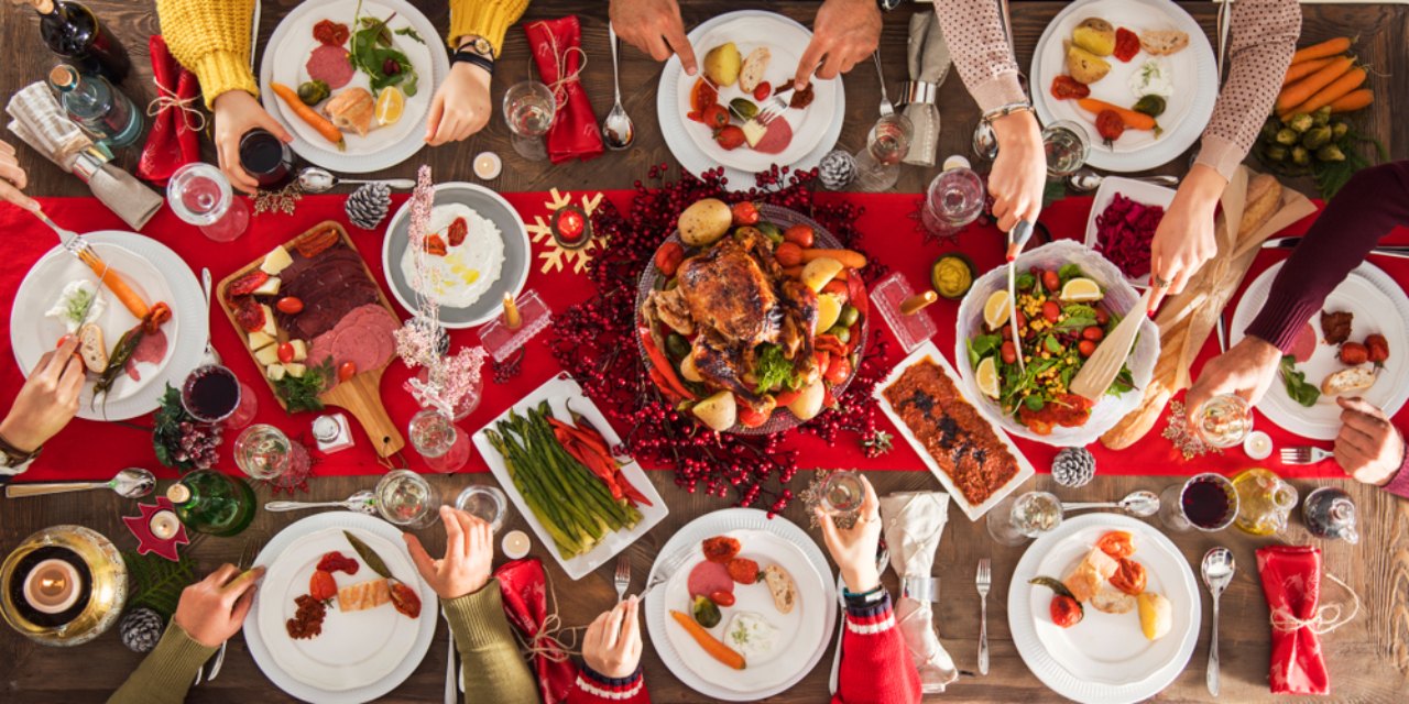 People around a sharing table enjoying Christmas lunch at Venachar Lochside