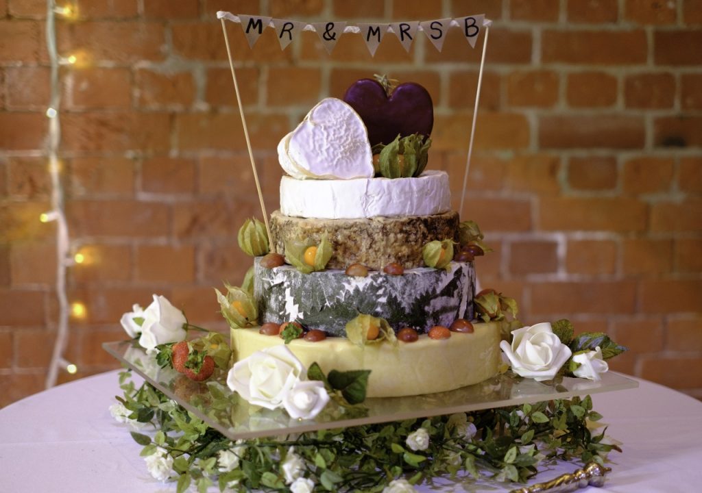 Cheese wedding cake with rustic background