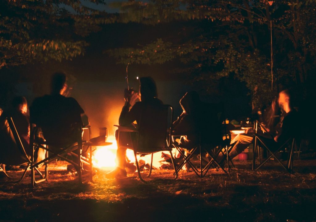 People gathered around a fire pit