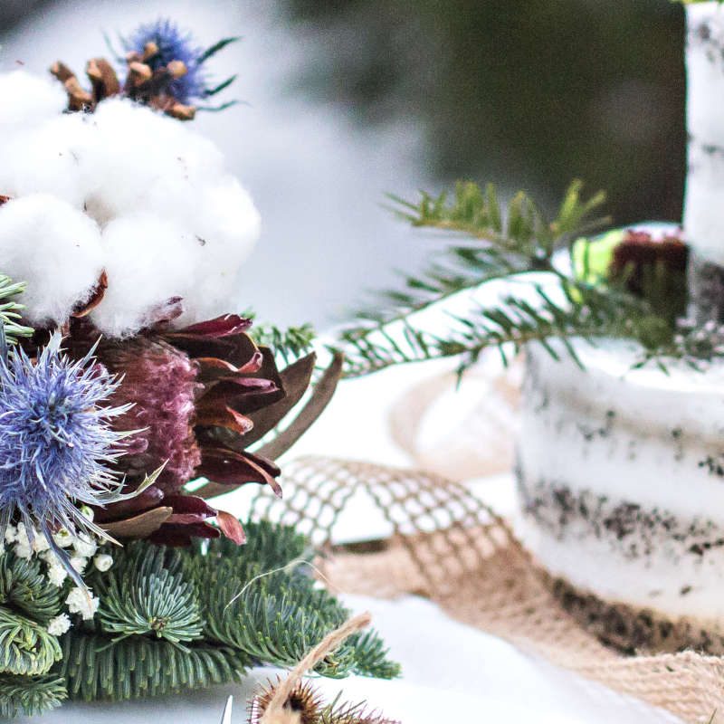 Winter wedding table with cake, champagne and flowers