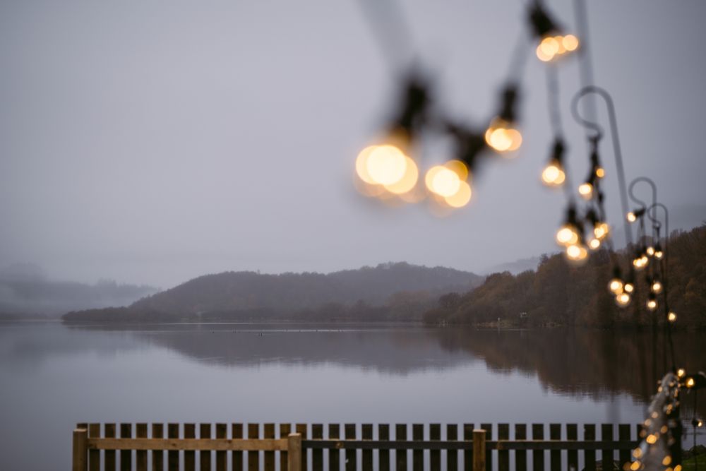 lochside view from Venachar Lochside wedding venue with fairy lights. 